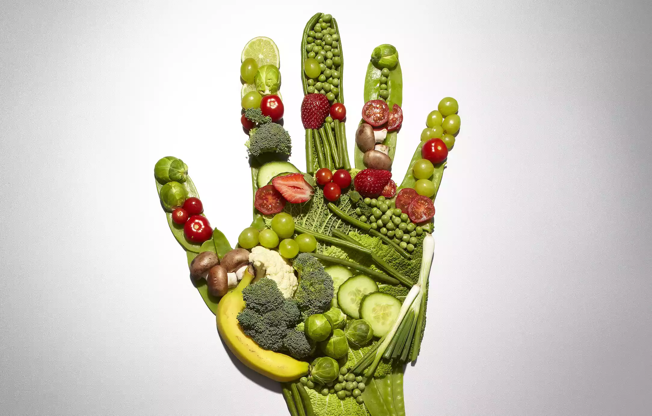 Fruit and vegetables forming a hand shape