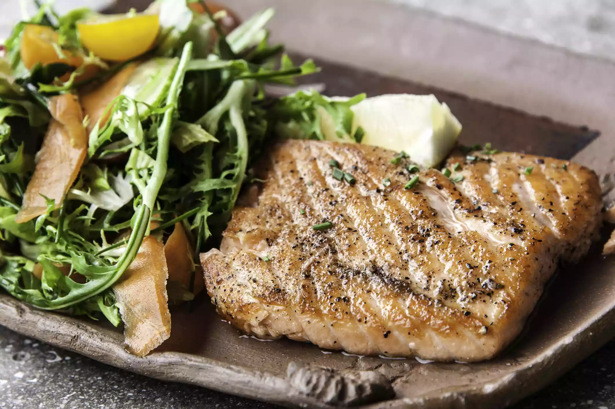 Grilled salmon and side salad